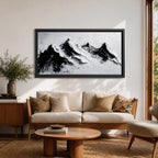 Panoramic black and white painting of alpine peaks with dramatic snowy mountains rising through mist and clouds. Thick textured brushstrokes create strong contrast between dark rocky ridges and bright snowfields, forming a minimalist monochrome mountain landscape stretching across a wide composition.