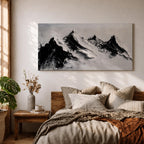 Panoramic black and white painting of alpine peaks with dramatic snowy mountains rising through mist and clouds. Thick textured brushstrokes create strong contrast between dark rocky ridges and bright snowfields, forming a minimalist monochrome mountain landscape stretching across a wide composition.