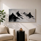 Panoramic black and white painting of alpine peaks with dramatic snowy mountains rising through mist and clouds. Thick textured brushstrokes create strong contrast between dark rocky ridges and bright snowfields, forming a minimalist monochrome mountain landscape stretching across a wide composition.