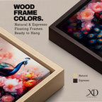Panoramic painting of a vibrant peafowl with a flowing blue and teal tail surrounded by large blooming peony flowers. Rich pink, coral, and red petals fill the composition while detailed feather eyes shimmer across the long tail, creating a colorful botanical scene with dramatic contrast and soft glowing light.