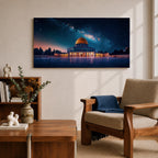 Panoramic night scene of the Dome of the Rock mosque in Jerusalem illuminated beneath a star filled sky and Milky Way galaxy. The golden dome reflects soft light across the courtyard while the historic Islamic architecture stands against the deep blue night horizon.