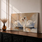 Panoramic painting depicting two white swans facing each other on calm water with their curved necks forming a heart shape. Soft brushstrokes and warm neutral tones surround the birds while gentle reflections appear on the lake surface, creating a serene composition centered on the pair of swans.