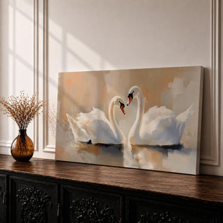 Panoramic painting depicting two white swans facing each other on calm water with their curved necks forming a heart shape. Soft brushstrokes and warm neutral tones surround the birds while gentle reflections appear on the lake surface, creating a serene composition centered on the pair of swans.