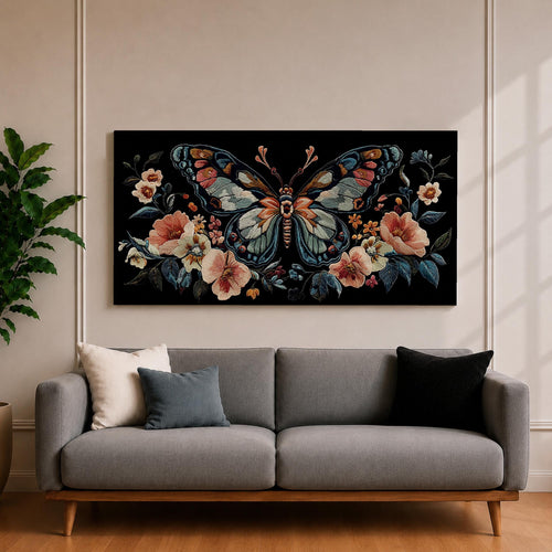 Panoramic artwork depicting a large symmetrical butterfly with intricate patterned wings in blue, cream, and rust tones surrounded by blooming flowers and leafy botanical elements. The composition resembles detailed embroidered textile artwork set against a deep black background with balanced floral arrangements framing the butterfly.