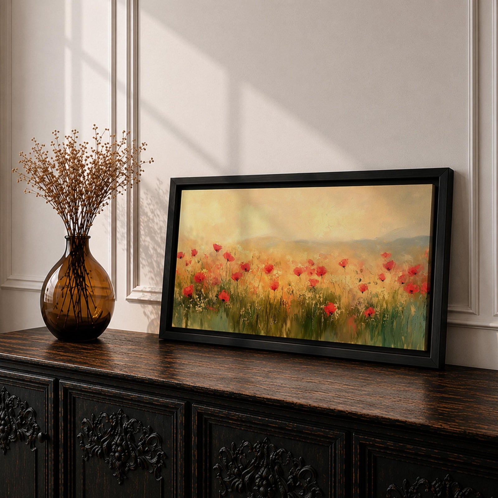Panoramic painting of a wild poppy field filled with red blossoms scattered across tall grasses and soft meadow plants. The scene shows glowing golden light across the landscape with distant hills fading into a warm sky, while loose brushstrokes capture the movement of wildflowers spread across the field.