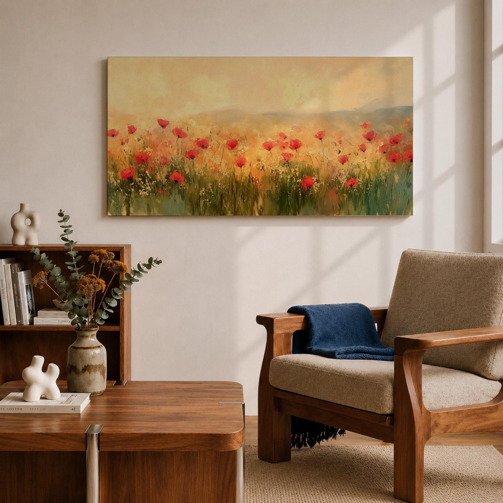 Panoramic painting of a wild poppy field filled with red blossoms scattered across tall grasses and soft meadow plants. The scene shows glowing golden light across the landscape with distant hills fading into a warm sky, while loose brushstrokes capture the movement of wildflowers spread across the field.