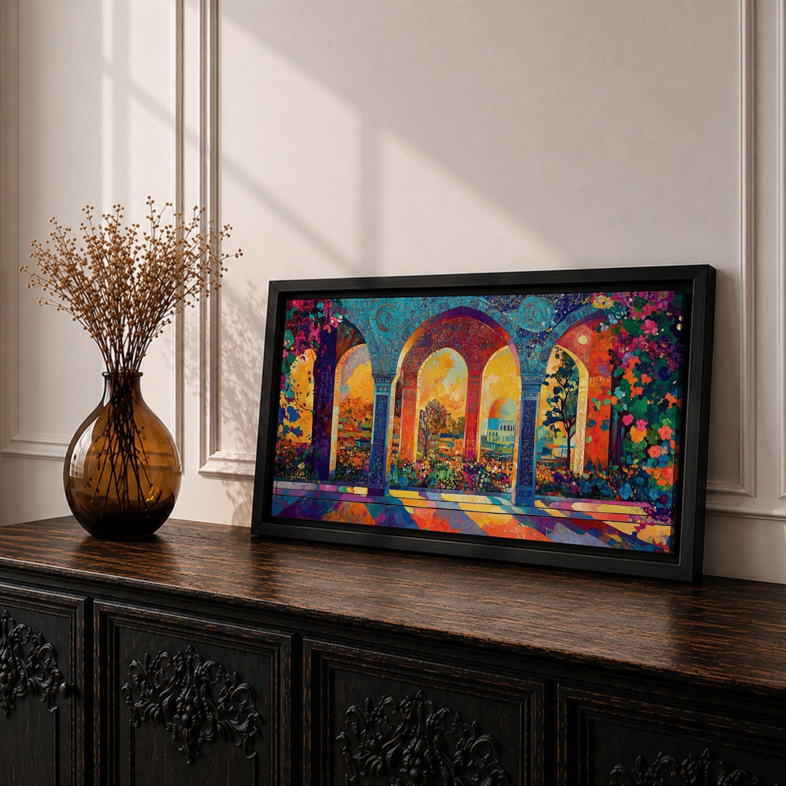 Panoramic artwork depicting ornate Moorish arches opening into a vibrant garden courtyard filled with colorful flowers and trees. Decorative tiled columns frame the arches while warm sunlight streams through, casting multicolored reflections across the floor and highlighting the detailed Islamic architectural patterns.