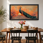 Panoramic artwork depicting a peacock standing on a rocky hill with its long iridescent tail feathers flowing behind it. The bird faces a glowing sunset with warm orange clouds and soft light illuminating the detailed blue and green plumage while flowering trees frame the scene.