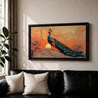 Panoramic artwork depicting a peacock standing on a rocky hill with its long iridescent tail feathers flowing behind it. The bird faces a glowing sunset with warm orange clouds and soft light illuminating the detailed blue and green plumage while flowering trees frame the scene.