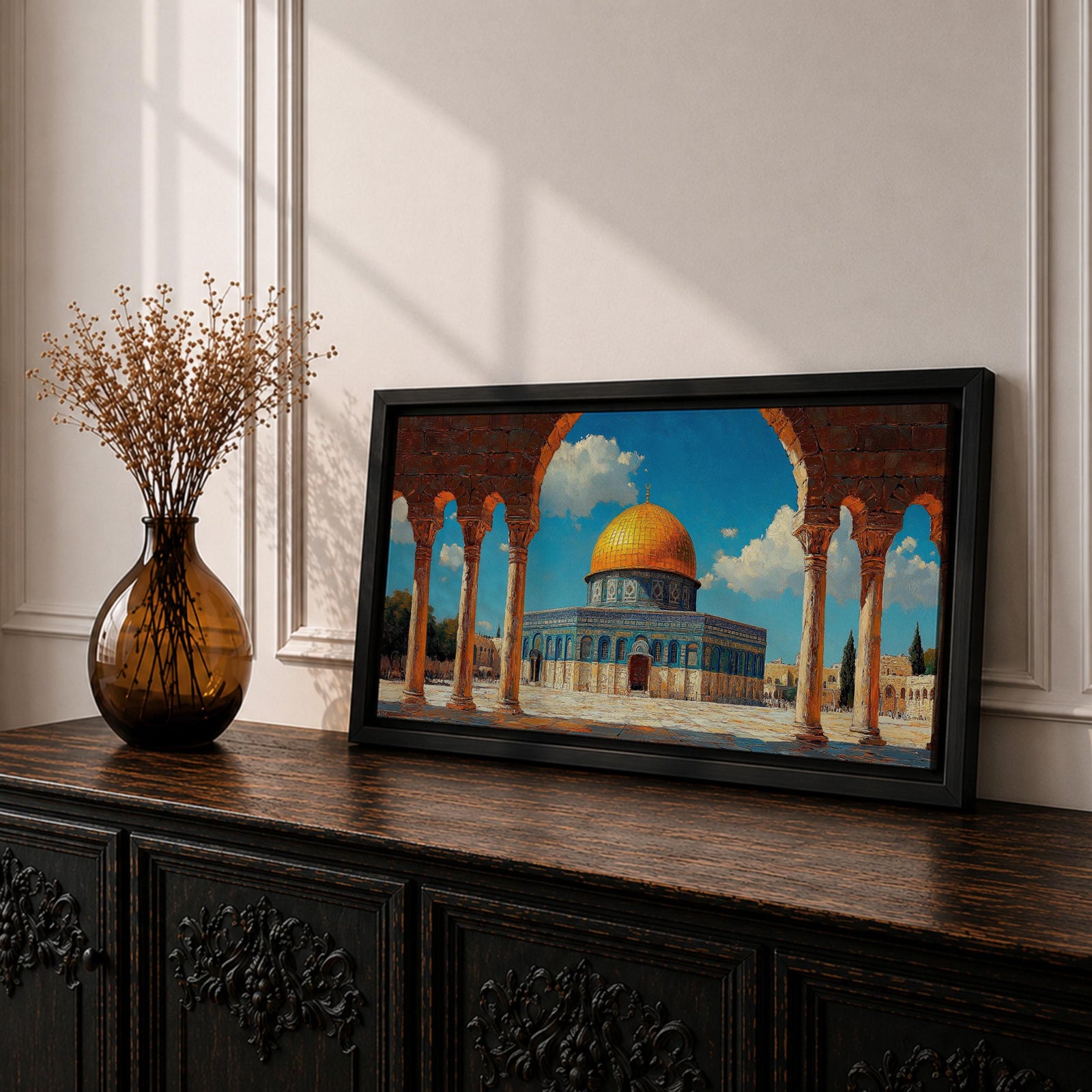 Panoramic artwork depicting the Dome of the Rock with its golden dome rising above blue tiled walls and stone courtyard. The mosque is framed by tall historic arches and columns in the foreground while bright blue sky and soft clouds highlight the iconic Jerusalem Islamic landmark.
