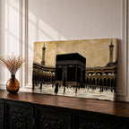 Panoramic artwork depicting the Kaaba at the center of Masjid Al Haram in Mecca surrounded by the mosque’s arcades and tall minarets. Pilgrims gather around the Kaaba across the bright courtyard floor while the dark cubic structure contrasts against the warm sky and detailed mosque architecture.