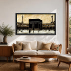 Panoramic artwork depicting the Kaaba at the center of Masjid Al Haram in Mecca surrounded by the mosque’s arcades and tall minarets. Pilgrims gather around the Kaaba across the bright courtyard floor while the dark cubic structure contrasts against the warm sky and detailed mosque architecture.