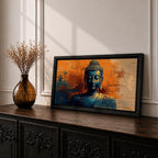 Panoramic artwork depicting a serene Buddha portrait with closed eyes and calm expression against a textured abstract background. Deep blue tones define the figure while bold orange and gold brushstrokes create contrast around the head and shoulders, emphasizing a tranquil meditative presence.