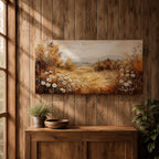 Panoramic landscape painting depicting a golden autumn meadow with white daisies blooming along the foreground. Warm earthy tones fill the grassy field while trees with autumn foliage frame the scene and distant hills fade softly beneath a calm sky.