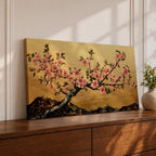 A panoramic painting of a flowering cherry blossom branch extending across the composition with clusters of soft pink sakura flowers and dark textured bark, set against a rich gold background with distant mountain silhouettes, rendered in a Japanese inspired style with detailed petals and balanced horizontal composition.