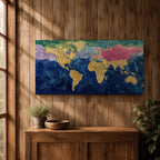 A panoramic abstract world map painting showing continents in raised textured gold tones surrounded by deep swirling blue oceans, with regions highlighted in pastel shades across Europe, Asia, and North America, creating a modern atlas style composition with rich brushwork and layered surface texture.