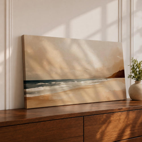 Panoramic coastal landscape painting showing a quiet sandy beach with gentle ocean waves rolling onto the shore beneath a soft sky. Subtle tones of beige, blue, and warm gray create a calm atmosphere while distant hills stretch along the horizon and light reflects across the water.