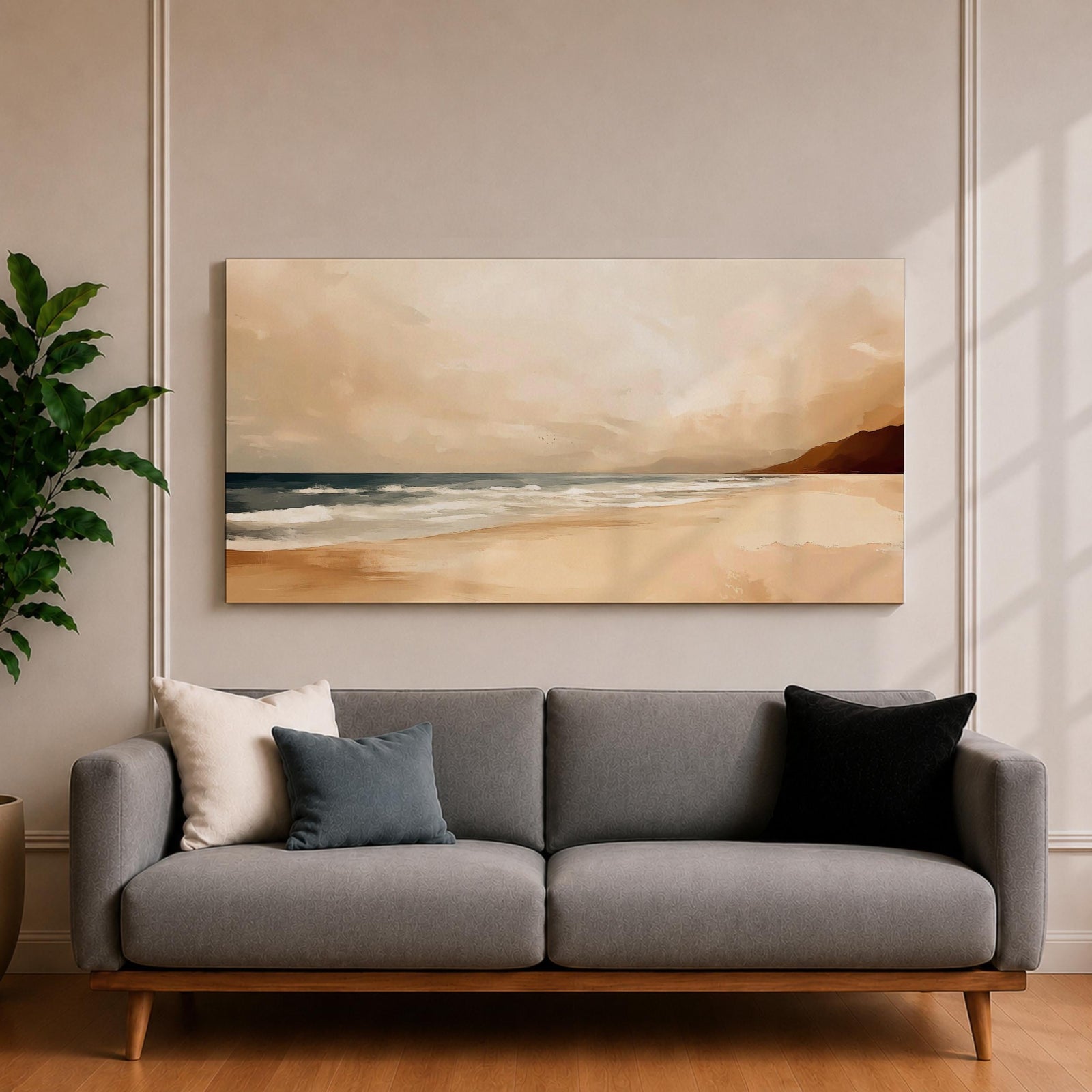 Panoramic coastal landscape painting showing a quiet sandy beach with gentle ocean waves rolling onto the shore beneath a soft sky. Subtle tones of beige, blue, and warm gray create a calm atmosphere while distant hills stretch along the horizon and light reflects across the water.