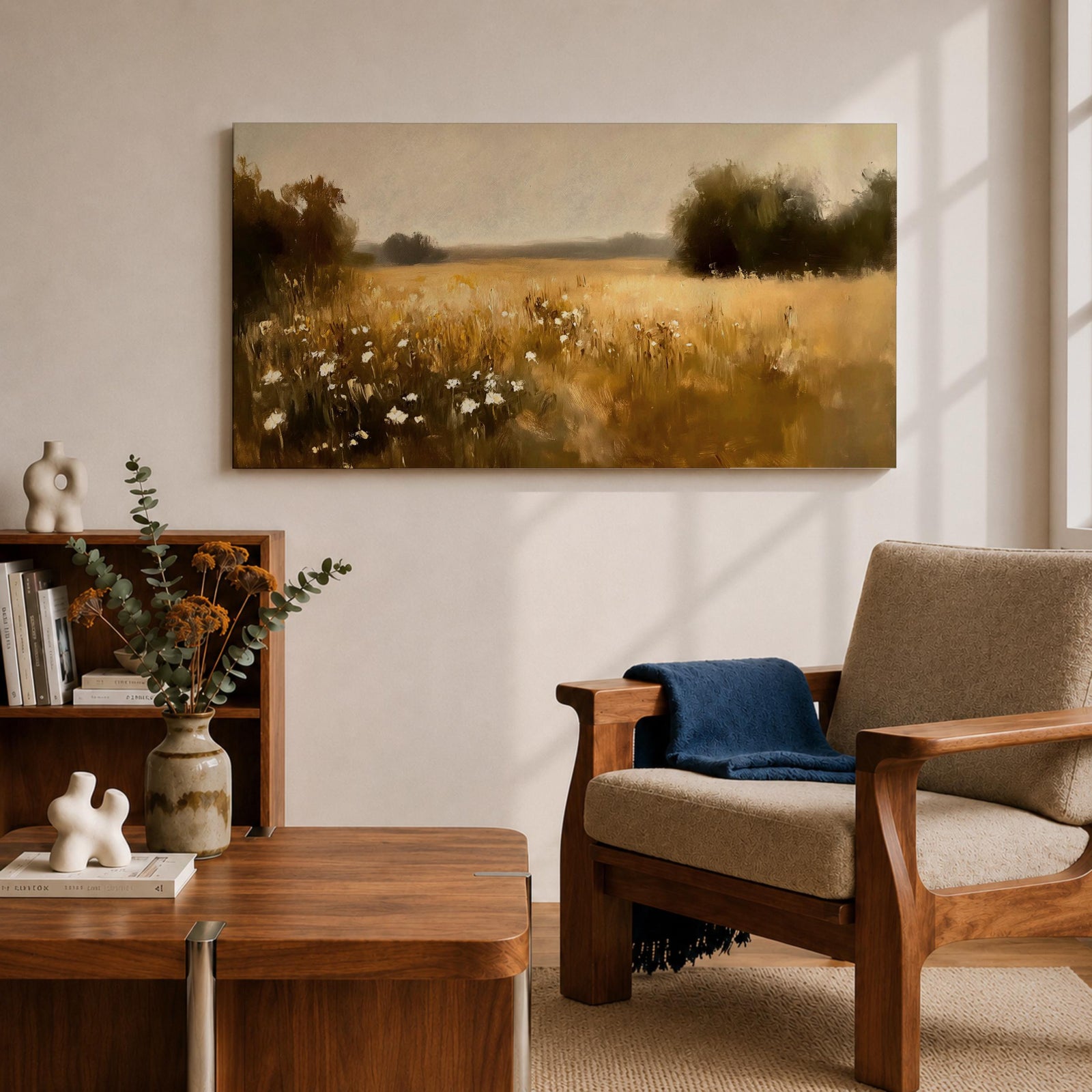A panoramic painting of a golden meadow filled with tall grasses and scattered white wildflowers stretching across an open countryside field toward a distant horizon, bordered by darker tree clusters and rendered with soft impressionist brushstrokes in warm earthy tones that create depth and a quiet rural atmosphere.