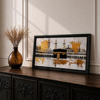 Panoramic painting of the Kaaba in Mecca centered within Masjid al Haram featuring the black cube sanctuary draped in the kiswah with gold calligraphy bands. Tall mosque minarets and long arched colonnades frame the courtyard while bold gold abstract paint textures and layered architectural lines extend across the wide horizontal composition.