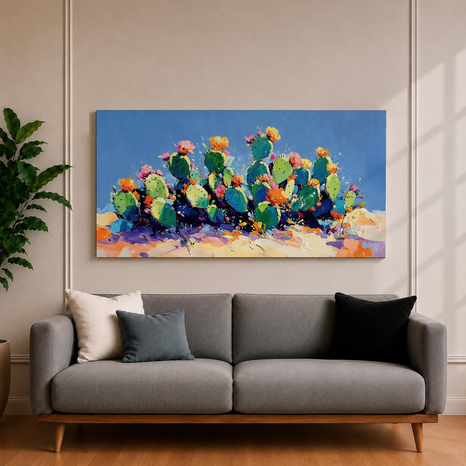 Panoramic painting of desert prickly pear cactus plants with bright pink and yellow blooming flowers growing across a colorful arid landscape. Thick palette knife brushstrokes create textured cactus pads vibrant blossoms and layered desert hills beneath a glowing sky forming a wide southwestern desert scene.