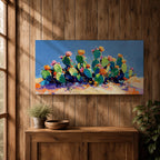 Panoramic painting of desert prickly pear cactus plants with bright pink and yellow blooming flowers growing across a colorful arid landscape. Thick palette knife brushstrokes create textured cactus pads vibrant blossoms and layered desert hills beneath a glowing sky forming a wide southwestern desert scene.