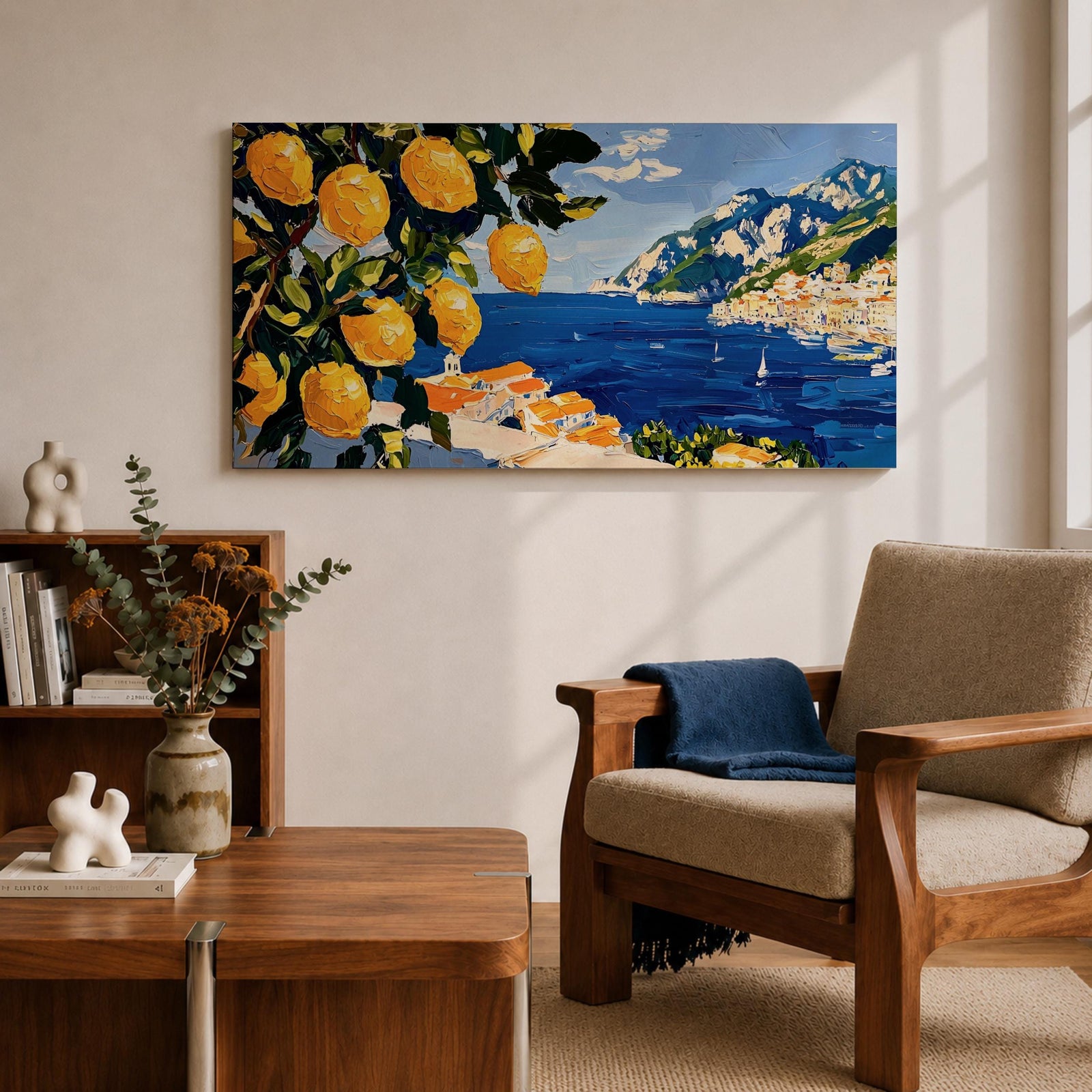 Panoramic painting of bright yellow lemons hanging from leafy branches overlooking the Amalfi Coast with deep blue Mediterranean water, sailboats, and a hillside Italian village with terracotta roofs beneath rugged mountains. Thick palette knife brushstrokes create textured citrus fruit foliage and coastal architecture in a wide landscape composition.