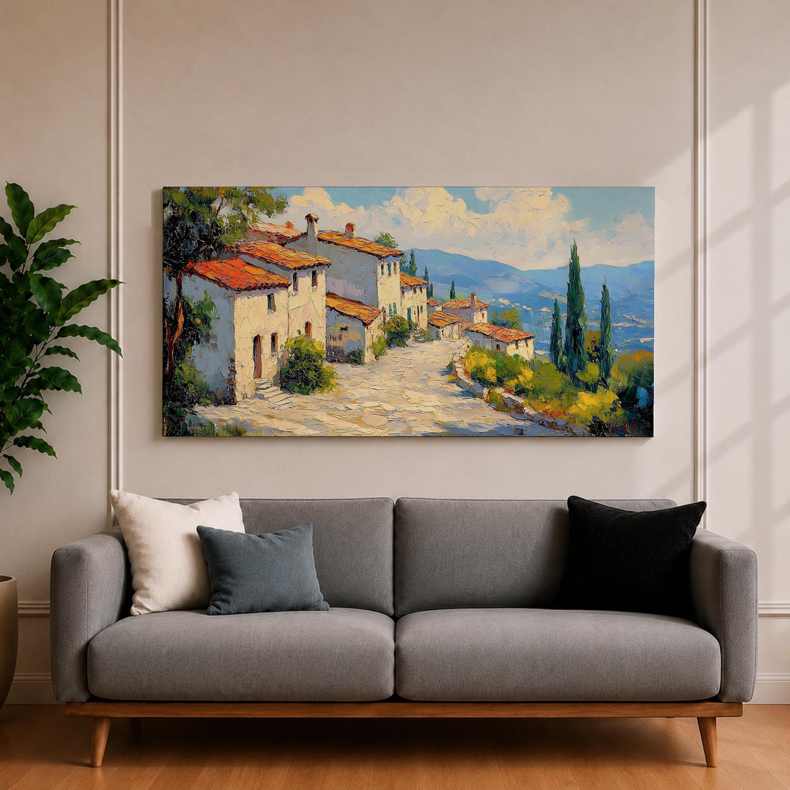 Panoramic painting of a Mediterranean hillside village with warm stone houses and terracotta roofs overlooking the rolling Tuscany hills. Thick palette knife brushstrokes create textured buildings cypress trees and layered green landscapes beneath a glowing sky forming a wide Italian countryside scene.