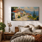 Panoramic painting of a Mediterranean hillside village with warm stone houses and terracotta roofs overlooking the rolling Tuscany hills. Thick palette knife brushstrokes create textured buildings cypress trees and layered green landscapes beneath a glowing sky forming a wide Italian countryside scene.