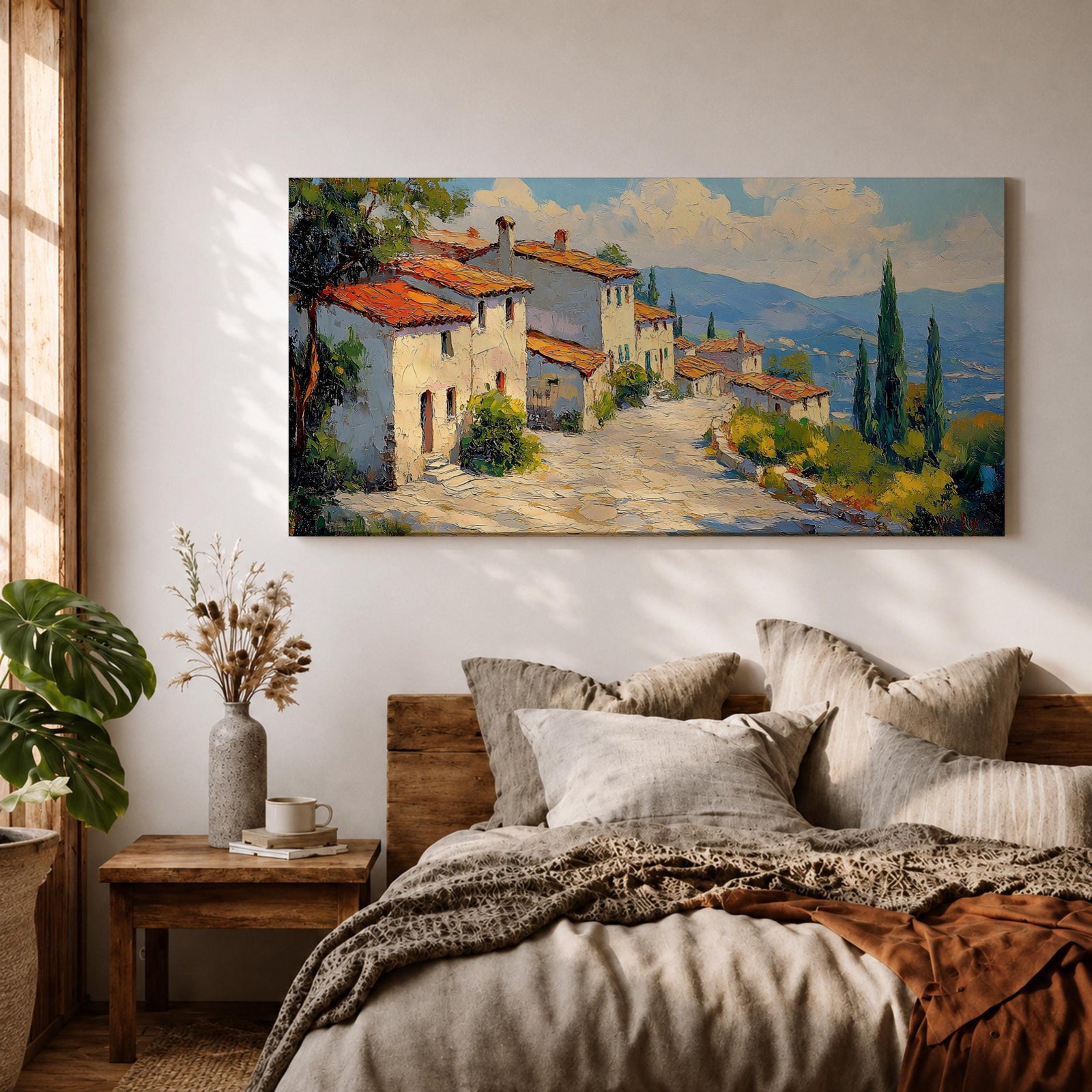 Panoramic painting of a Mediterranean hillside village with warm stone houses and terracotta roofs overlooking the rolling Tuscany hills. Thick palette knife brushstrokes create textured buildings cypress trees and layered green landscapes beneath a glowing sky forming a wide Italian countryside scene.