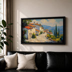 Panoramic painting of a Mediterranean hillside village with warm stone houses and terracotta roofs overlooking the rolling Tuscany hills. Thick palette knife brushstrokes create textured buildings cypress trees and layered green landscapes beneath a glowing sky forming a wide Italian countryside scene.