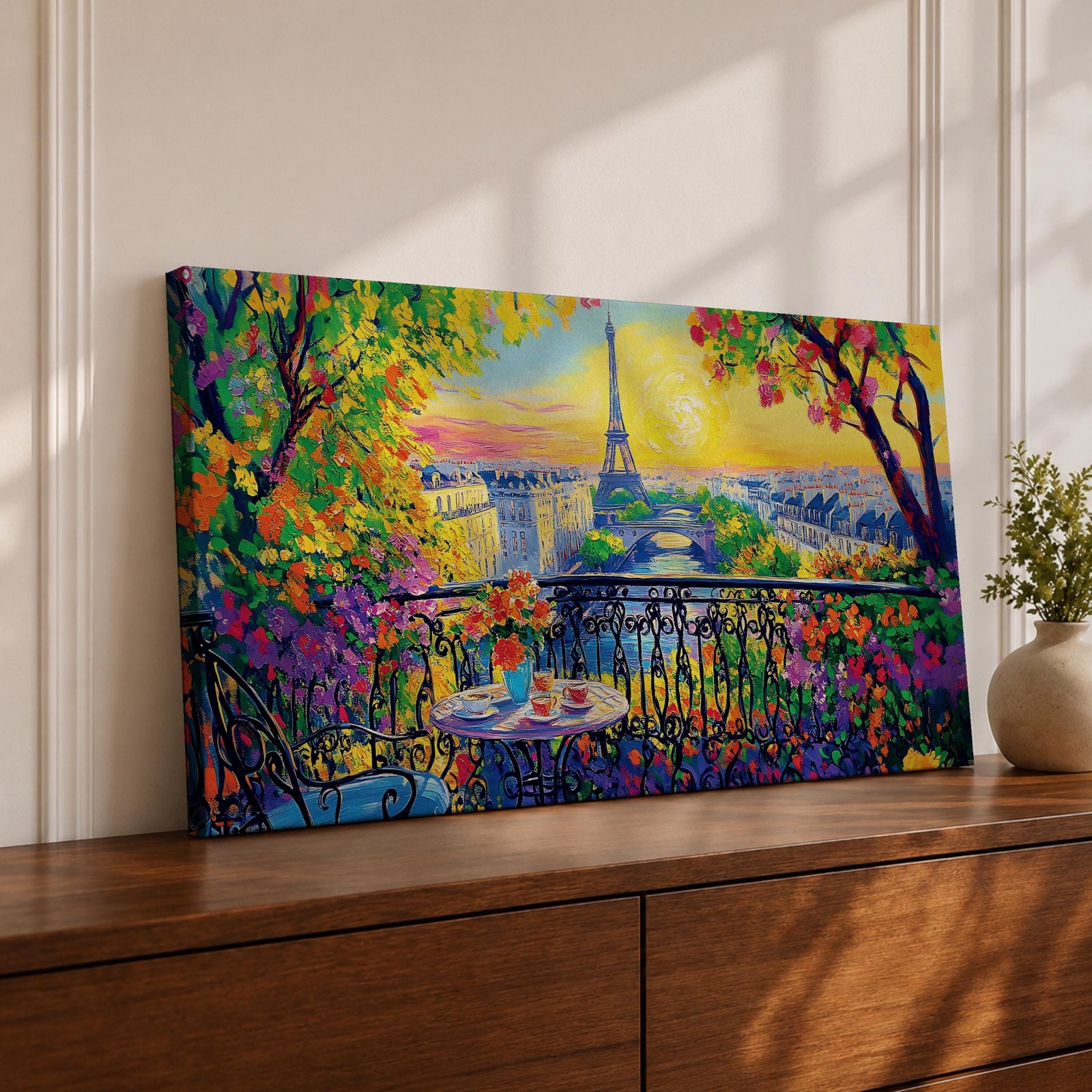 Panoramic painting of the Tour Eiffel rising above the Paris skyline viewed from the Champ de Mars with colorful textured brushstrokes forming surrounding buildings trees and glowing sky. Thick palette knife layers create vibrant reflections architectural details and expressive tones across the wide cityscape composition.