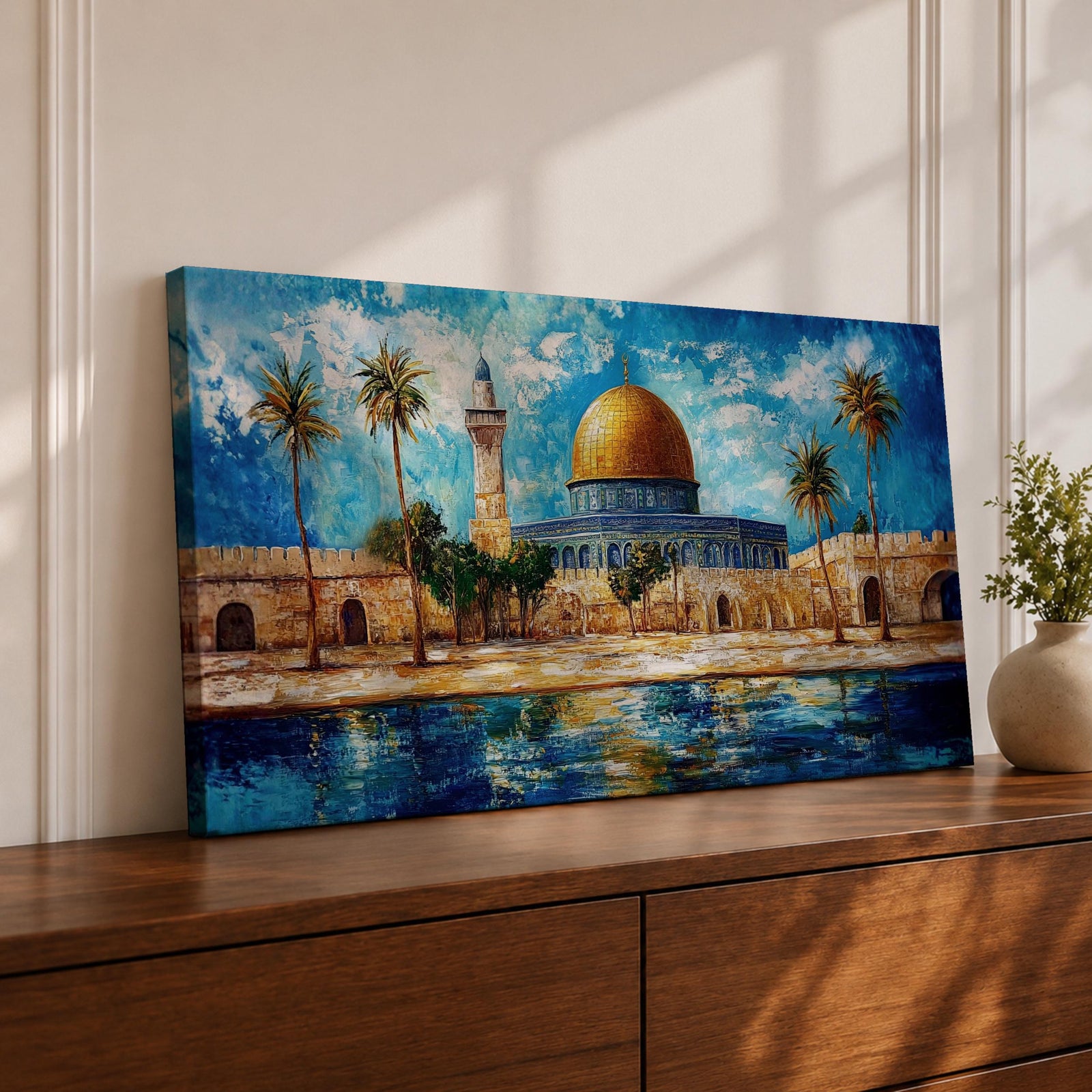A panoramic abstract painting of the Dome of the Rock in Jerusalem featuring its golden dome centered among palm trees and stone walls, reflected in water below, with vivid blue skies and expressive brushstrokes creating texture, depth, and a dynamic interpretation of historic Islamic architecture.