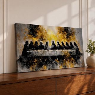 A dramatic panoramic interpretation of the Last Supper showing Jesus seated at the center with his apostles along a long table, rendered in a monochrome palette with striking gold accents and a radiant glowing aura behind Christ, creating a powerful and modern spiritual composition.