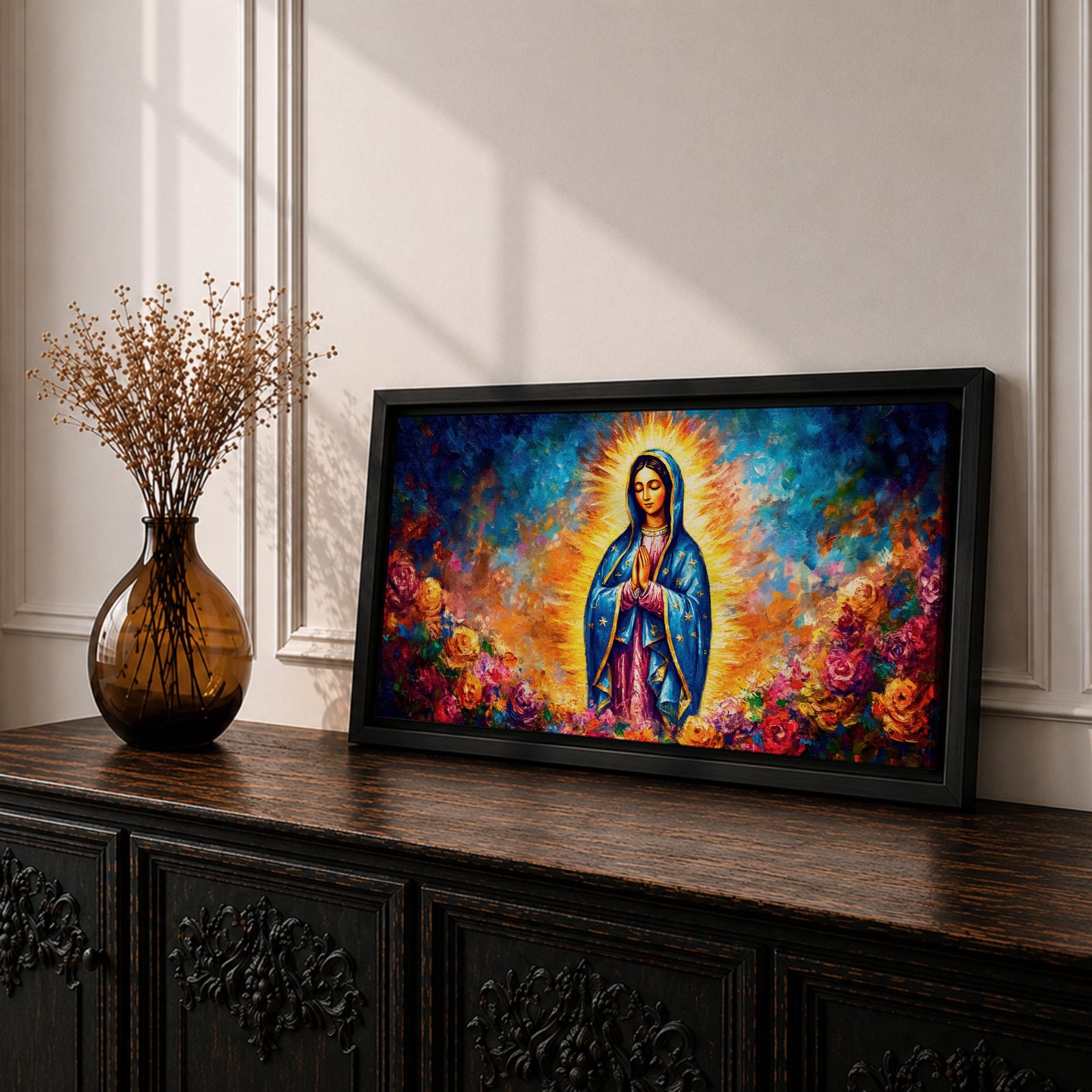 A panoramic devotional painting of Mary of Guadalupe standing in prayer with hands clasped, draped in a blue mantle with delicate star patterns and surrounded by a radiant golden aura, set against a richly textured background of deep blues, warm tones, and blooming roses that create a luminous and reverent composition.
