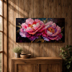 Panoramic floral painting of large pink peony blossoms in full bloom with layered petals and glowing golden centers set against a deep dark background. The composition highlights rich magenta, blush, and lavender tones with expressive brushwork and dramatic contrast, creating a bold close up botanical arrangement.