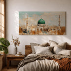 Panoramic abstract painting of Masjid Nabawi in Medina featuring the iconic green dome and two slender minarets rising above arches and mosque courtyards. The artwork uses thick textured brushstrokes in warm sand, gold, and cream tones with turquoise sky accents, highlighting the vibrant green dome in a wide horizontal composition.