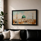 Panoramic abstract painting of Masjid Nabawi in Medina featuring the iconic green dome and two slender minarets rising above arches and mosque courtyards. The artwork uses thick textured brushstrokes in warm sand, gold, and cream tones with turquoise sky accents, highlighting the vibrant green dome in a wide horizontal composition.