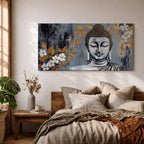 Panoramic painting of a serene Buddha portrait with closed eyes rendered in textured gray and gold tones. The composition features golden leaves and white blossoms surrounding the calm face, with layered brushstrokes and metallic accents creating contrast against a dark abstract background.