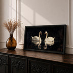 Panoramic painting of two white swans facing each other on dark reflective water with graceful curved necks forming a symmetrical composition. The birds glow against a deep black background with shimmering reflections and textured brushstrokes highlighting feathers and light across the calm water surface.