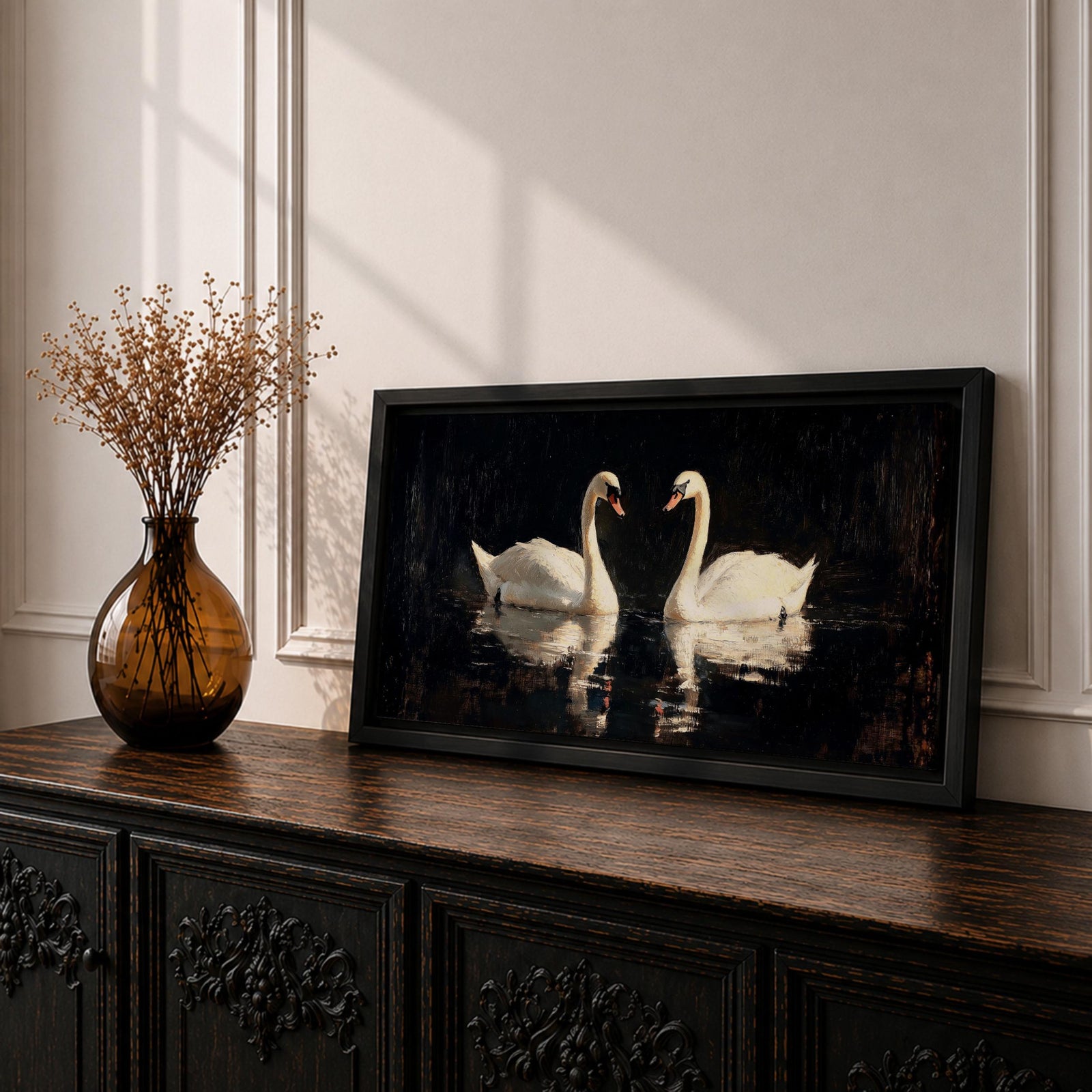 Panoramic painting of two white swans facing each other on dark reflective water with graceful curved necks forming a symmetrical composition. The birds glow against a deep black background with shimmering reflections and textured brushstrokes highlighting feathers and light across the calm water surface.