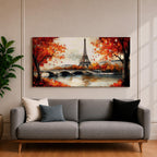 Panoramic painting of the Eiffel Tower rising above the Seine River with an arched stone bridge and classic Parisian buildings along the waterfront. Vibrant red and orange autumn trees frame the scene while textured brushstrokes reflect warm foliage and architecture across the calm river surface.