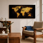 Panoramic artwork of a world map rendered in textured metallic gold against a deep black background. The continents appear with rough painterly edges and splattered gold accents, creating a bold global composition with strong contrast and modern map styling.