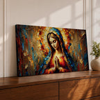 Panoramic textured painting of the Virgin Mary with hands clasped in prayer and a radiant halo behind her head. The composition features expressive palette knife strokes in gold, blue, red, and warm earth tones forming a luminous devotional portrait.