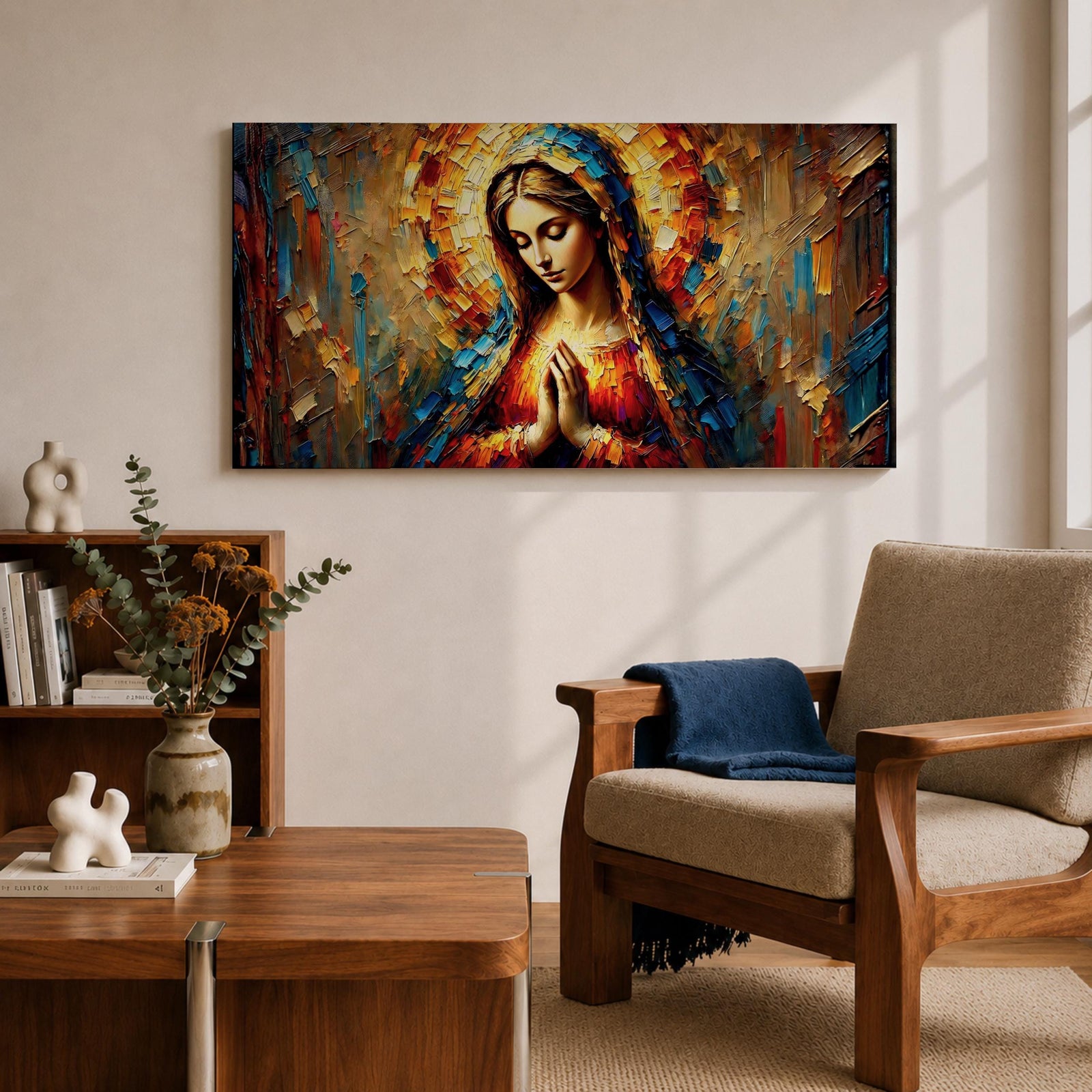 Panoramic textured painting of the Virgin Mary with hands clasped in prayer and a radiant halo behind her head. The composition features expressive palette knife strokes in gold, blue, red, and warm earth tones forming a luminous devotional portrait.