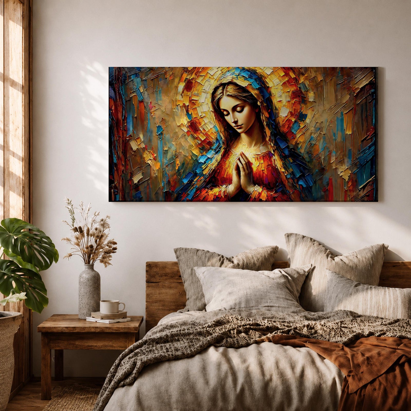 Panoramic textured painting of the Virgin Mary with hands clasped in prayer and a radiant halo behind her head. The composition features expressive palette knife strokes in gold, blue, red, and warm earth tones forming a luminous devotional portrait.