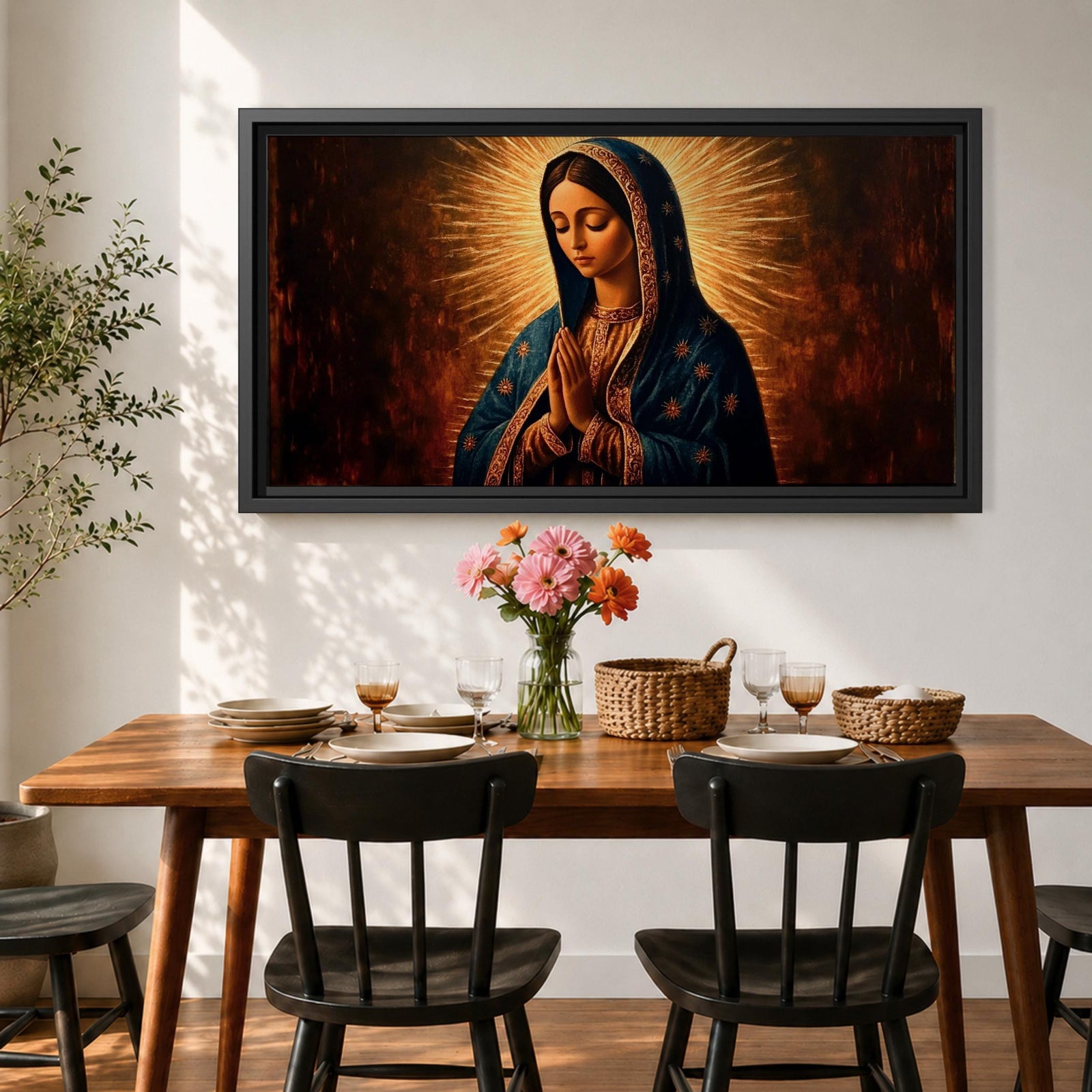 Panoramic religious painting of the Virgin Mary praying with hands together and head bowed, surrounded by a radiant golden halo against a warm dark background.