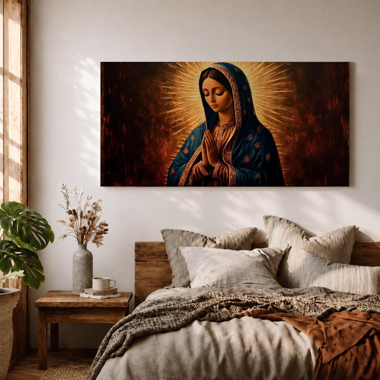 Panoramic religious painting of the Virgin Mary praying with hands together and head bowed, surrounded by a radiant golden halo against a warm dark background.
