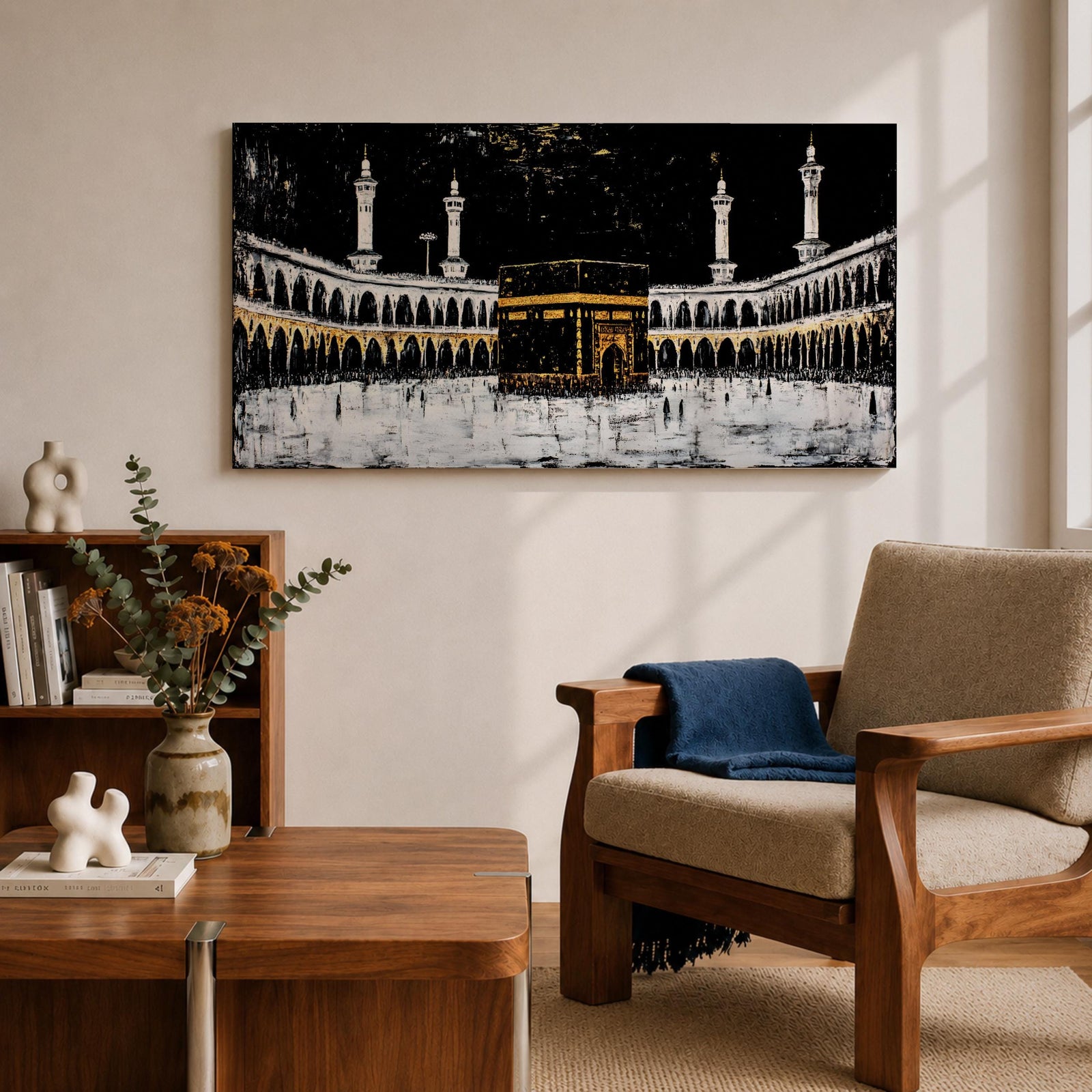 Panoramic artwork of the Kaaba at Masjid al-Haram in Mecca with black and gold accents surrounded by mosque arches and tall minarets against a dark night background.