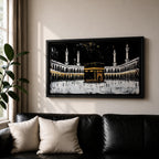 Panoramic artwork of the Kaaba at Masjid al-Haram in Mecca with black and gold accents surrounded by mosque arches and tall minarets against a dark night background.